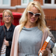 Pamela Anderson delivers lunch to Julian Assange at the Ecuadorian Embassy in London on October 15, 2016. Image via Getty.
